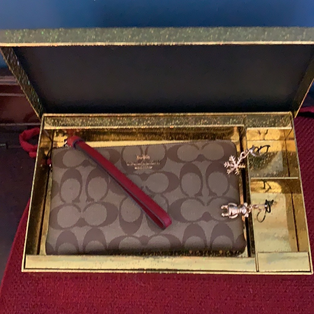 Brand new authentic Coach wristlet.